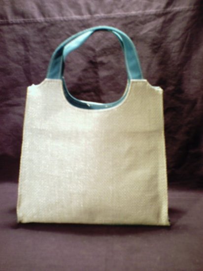 Tan and blue colored Estee Lauder handbag purse