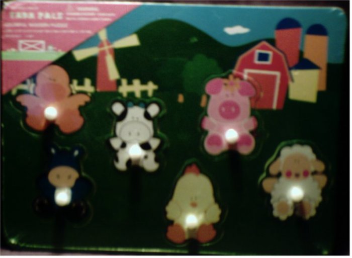 NIP Farm Pals colorful wooden puzzle with 6 animal pieces with handles