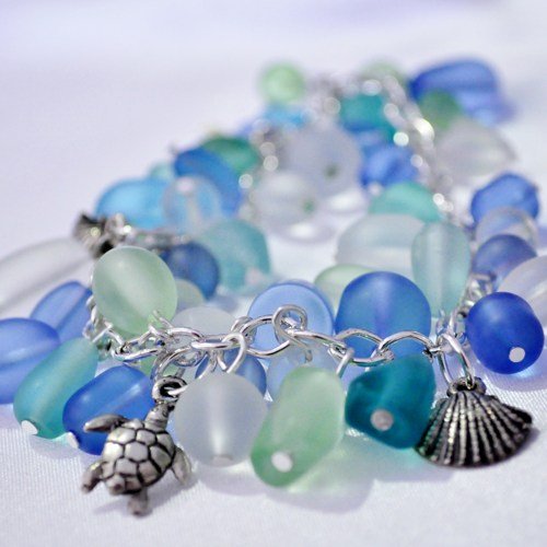 Sea glass charm bracelet with turtle and shell charms