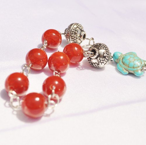 Red glass and turquoise bracelet with turtle bead accent