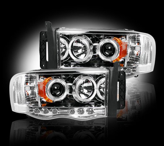 Part # 264191CL - CLEAR Projector Headlights Dodge RAM 02-05 w LED Halos & DRLs