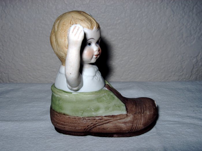 Ceramic Little Child in Shoe.