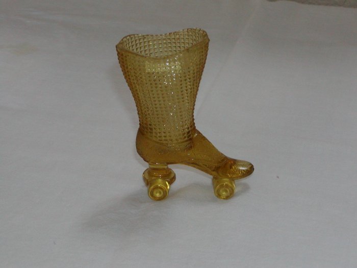 Amber Glass Boot on Skates (Central Glass Works of Wheeling, W. Va circa 1964-1974).