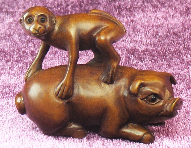 WS0108 Hand-Carved Boxwood Netsuke Monkey On Pig