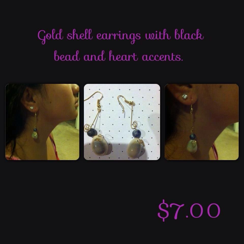 Gold Cowry Shell Earrings with Black Bead Accent.