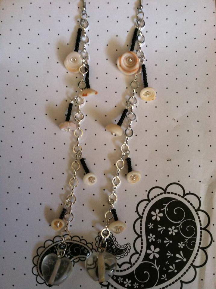 Silver chain style earrings. With puka shell, heart glass beads and black bead accents