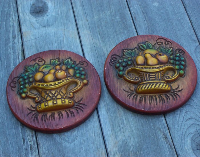 Two old wall plaques with fruit basket