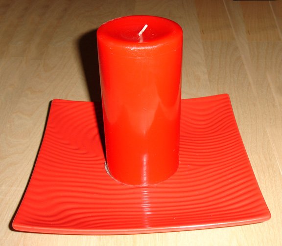 red candle + square red dish
