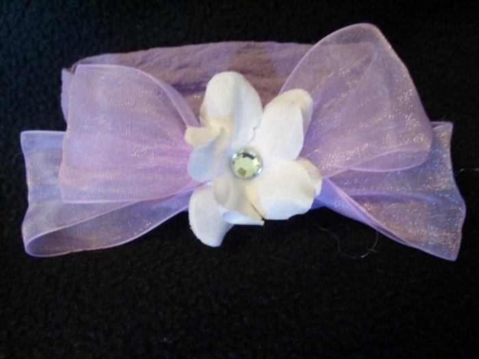 White flower, purple bow, purple band