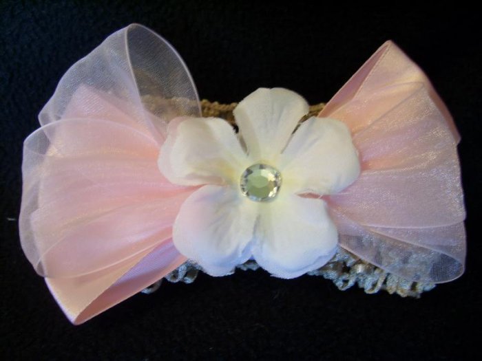 White flower on pink bow