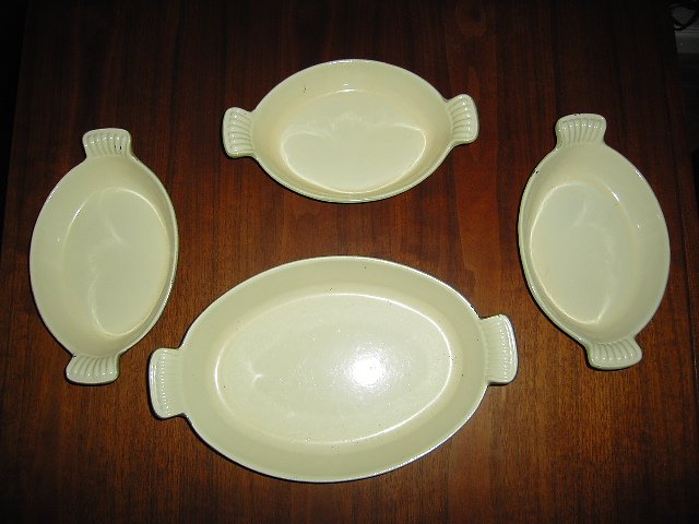 Four Cast iron and enamel cooking saucers by Mse co