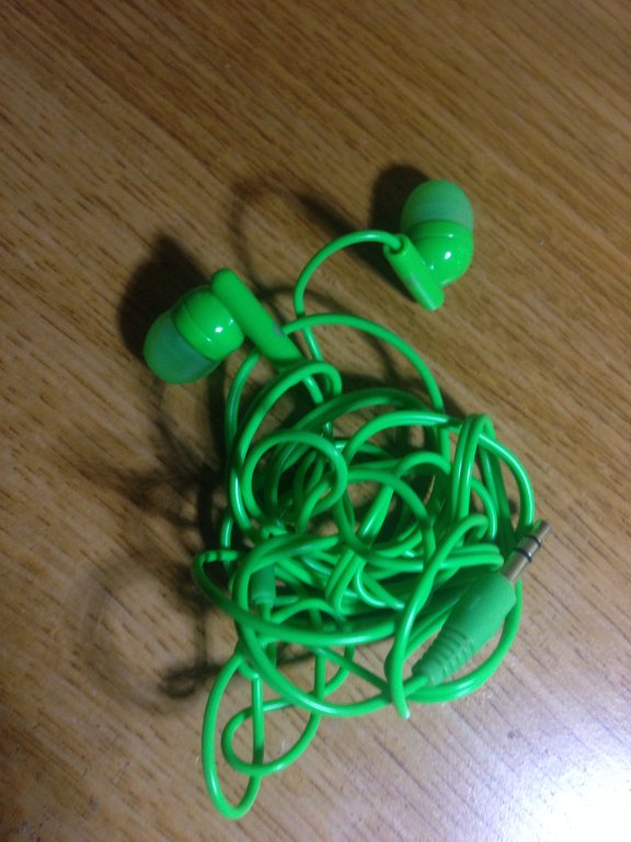 green ear bud headphones