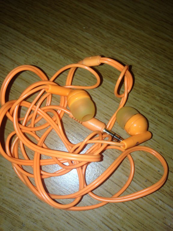 orange ear bud headphones
