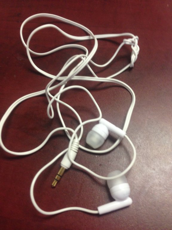 white ear bud headphones
