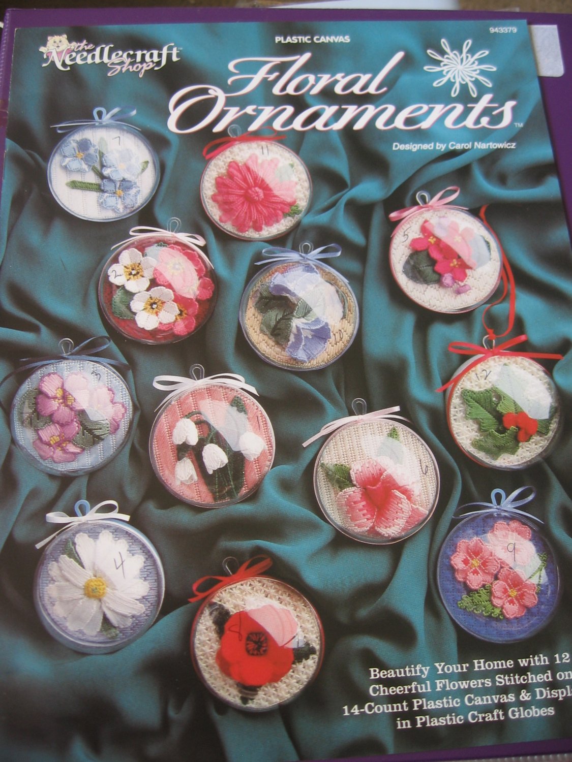 Floral Ornaments in Plastic Canvas Displayed in Plastic Craft Globes