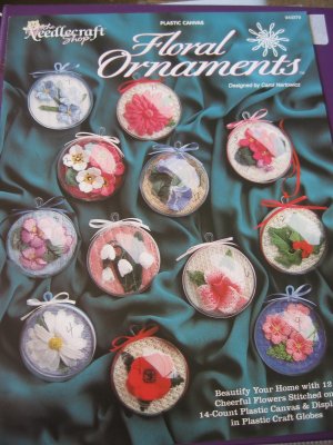 Floral Ornaments in Plastic Canvas Displayed in Plastic Craft Globes