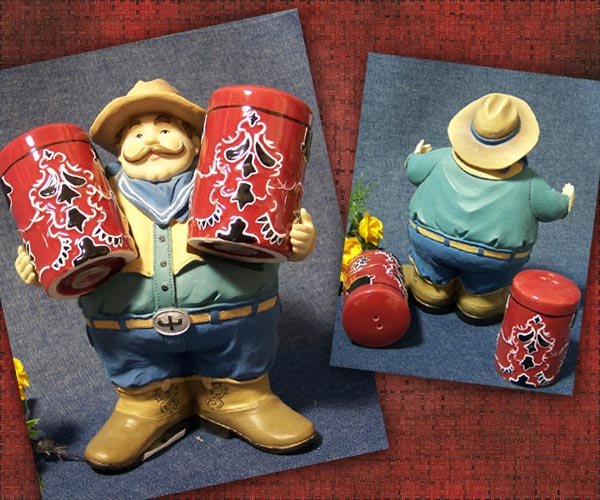 Large Cowboy holding Salt & Pepper Shakers