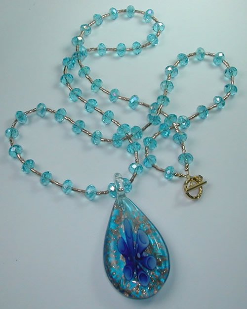 Turquoise Lampwork Pendant on Turquoise Crystal and Bead Necklace