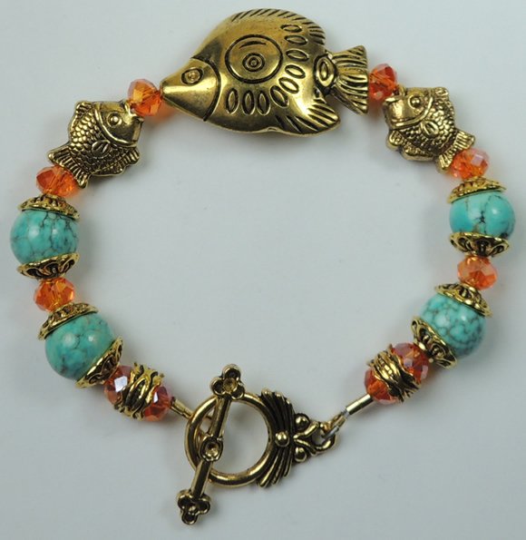 handcrafted Turquoise Howlite Bracelet with Orange Crystal and Gold Plated Fishes