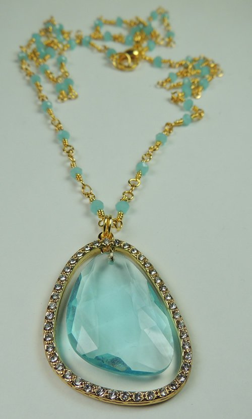 NEW WOMANS TURQUOISE CRYSTAL FRAMED BY RHINESTONES ON GOLD TONE CHAIN WITH TURQUOISE CRYSTALS