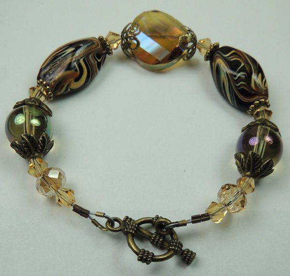 Black Brown & Beige Swirl Lampwork Bracelet Accented with Brass Tone Metal