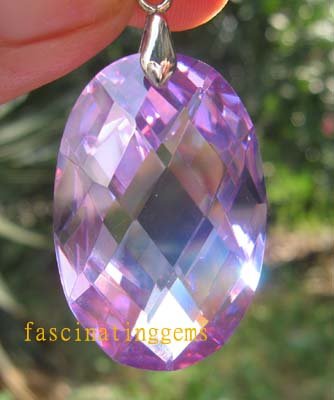 IF~50.00CT CHARMAING OVAL PURPLE ZIRCON PEADANT