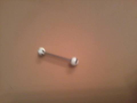 white and black tongue ring
