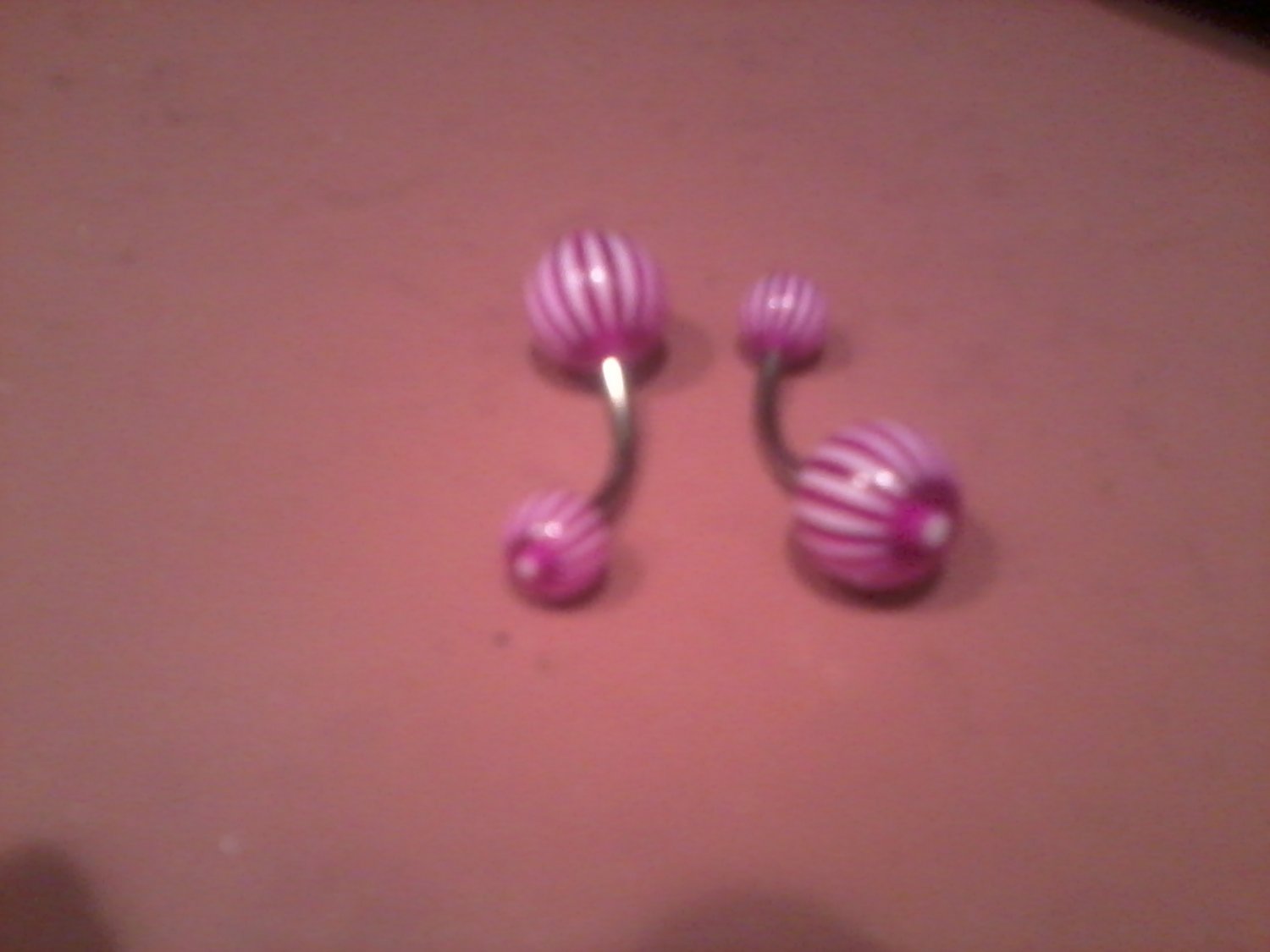 purple and white candy stripped belly button