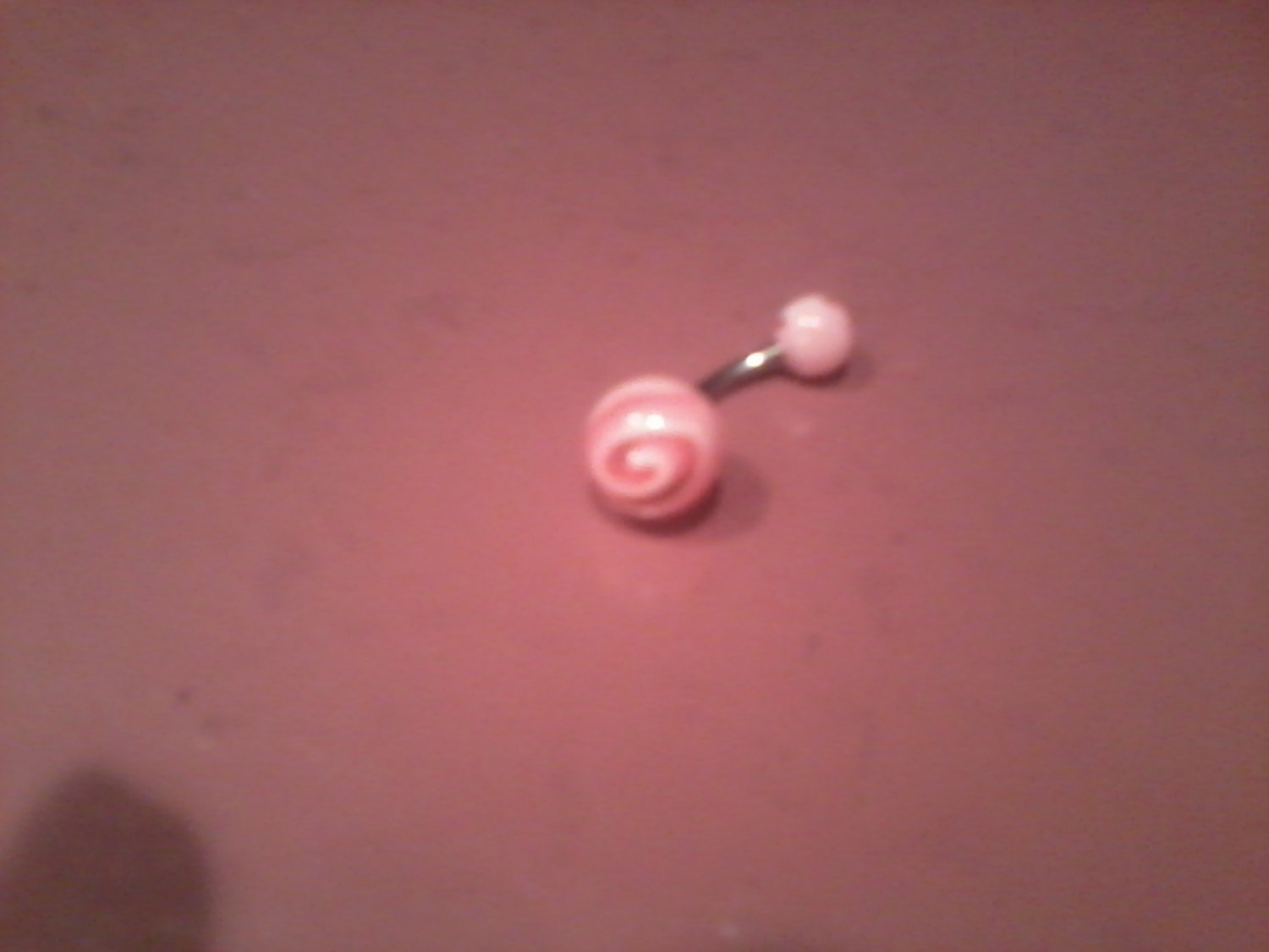 pink and white swirl round belly bitton pink