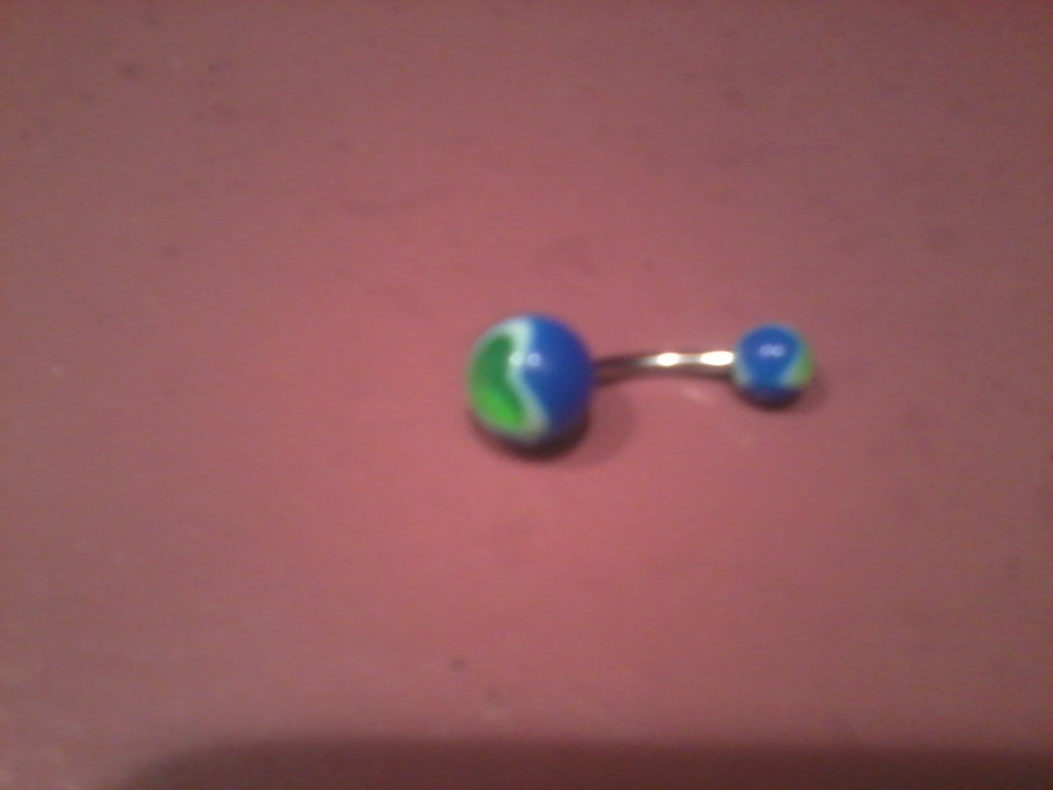 blue and green belly button ring