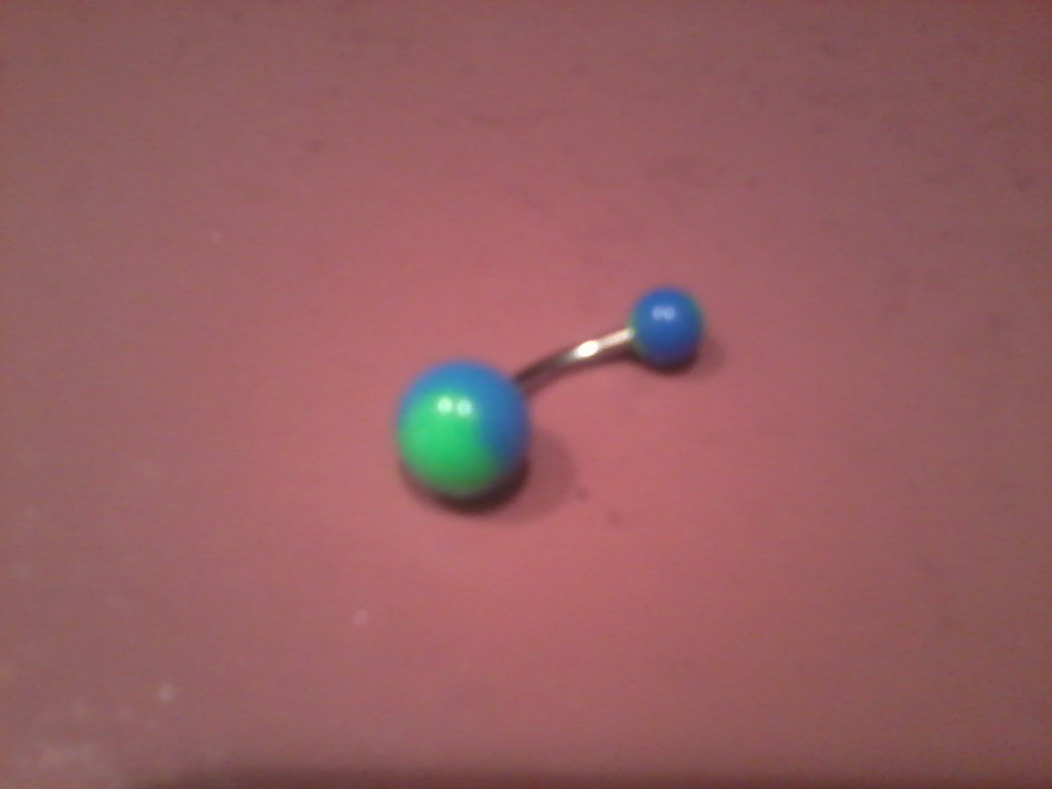 light blue with green belly button ring