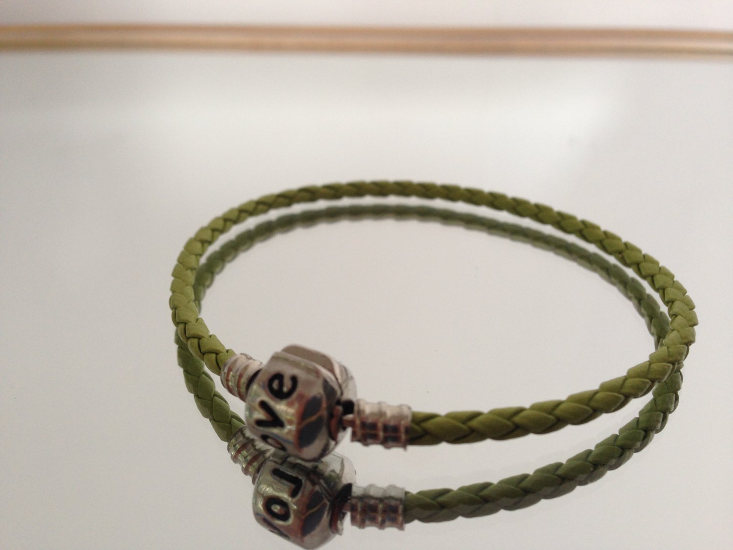 Braided Bracelet With Charm Closure