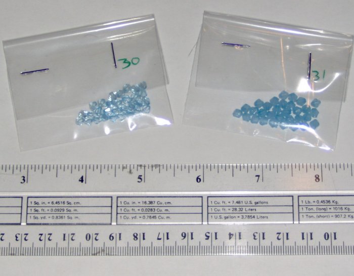 4mm acrylic plastic bicone beads - translucent and shiny light blue