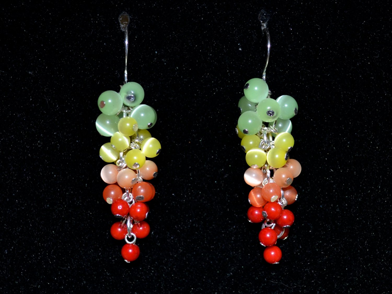 Earrings with cat's-eye and coral dangle from silver earwires