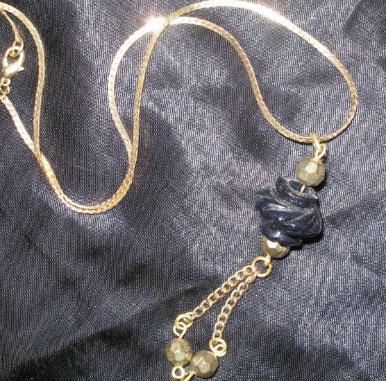 vintage gold necklace with black and gold pendant