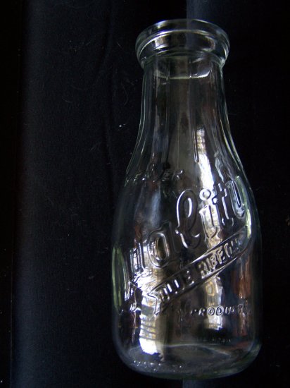 "Weaver Quality Blue Ribbon Products", Round clear glass small milk bottle