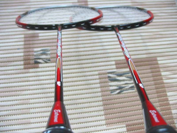 Badminton racket, shuttles and grips.
