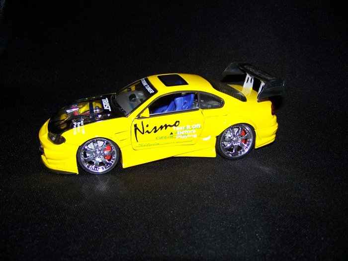 Yellow Extreme Tunner Car with moveable doors and hood, also has working lights