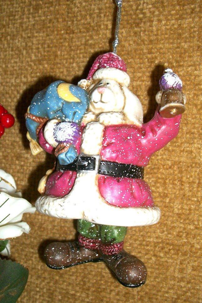 White Dog Dressed as Santa Claus with Toy Sack Ceramic Bell Christmas Ornament