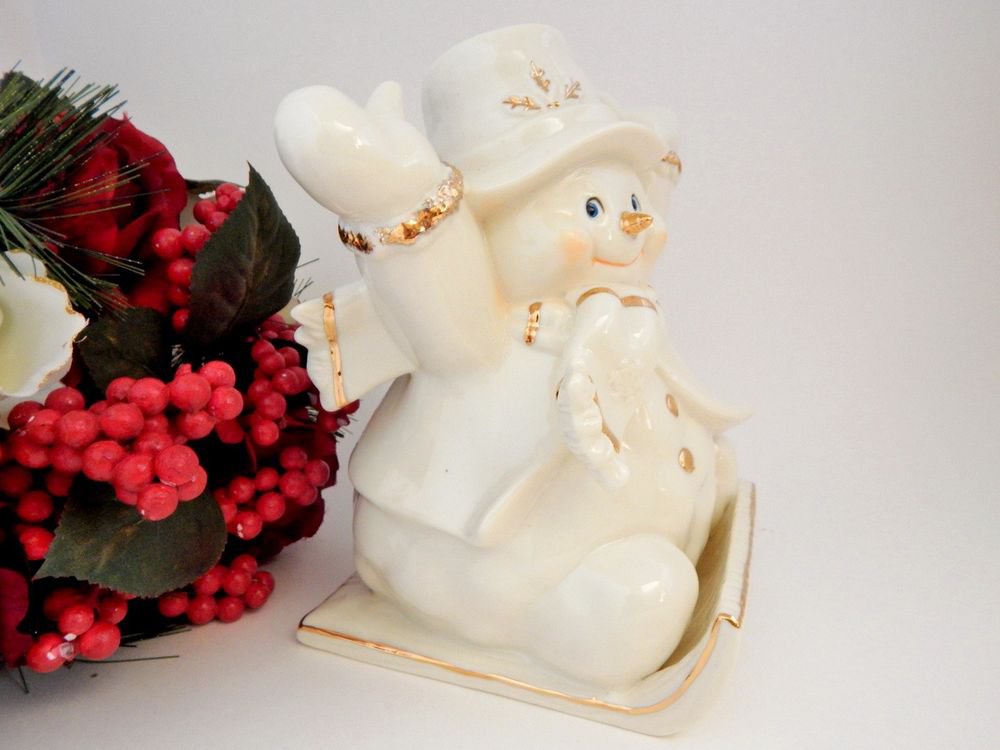 Sledding Snowman Christmas Figurine White and Gold Ceramic Winter Holiday Decor