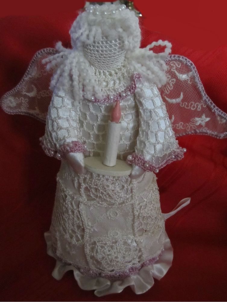 white Cloth Christmas Angel decoration with purple trim and holding a candle