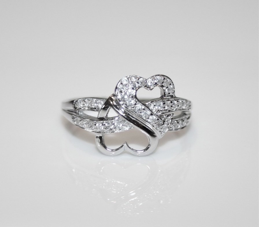 PRETTY STERLING SILVER PAVE SET CZ ENTWINED HEARTS RING (SIZES H - T)