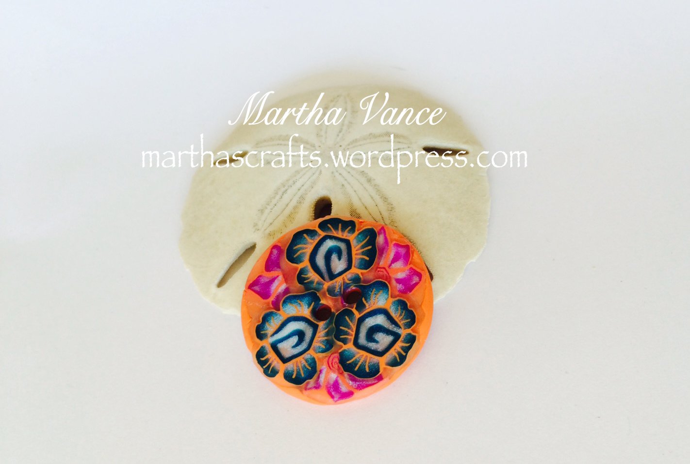 Coral polymer clay button with flowers