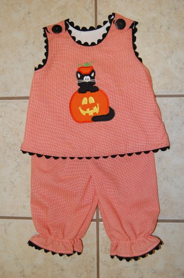 Kitty Cat in a pumpkin bloomer set.