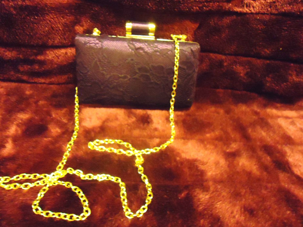 SMALL BURGUNDY MIZTIQUE HANDBAG WITH LONG SHOULDER CHAIN..APPROX 7" X 5"..ROOMY