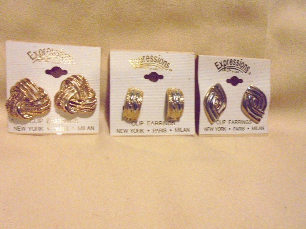 THREE PAIR OF CLIP ON EARRING.....NEW ON CARD...EXPRESSIONS BY ALMAR