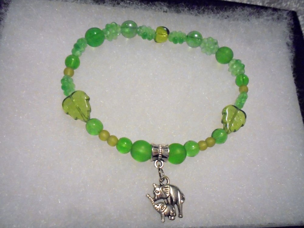 MIXED GREEN BEADED STRETCH WITH SILVER TONE DOUBLE ELEPHANT CHARM.....