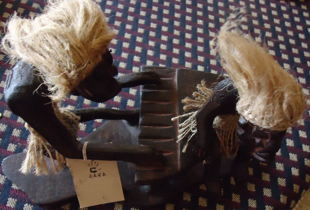 HANDCRAFTED WOODEN AFRICAN FIGURES..ONE PLAYING PIANO & OTHER SITTING ON PIANO..