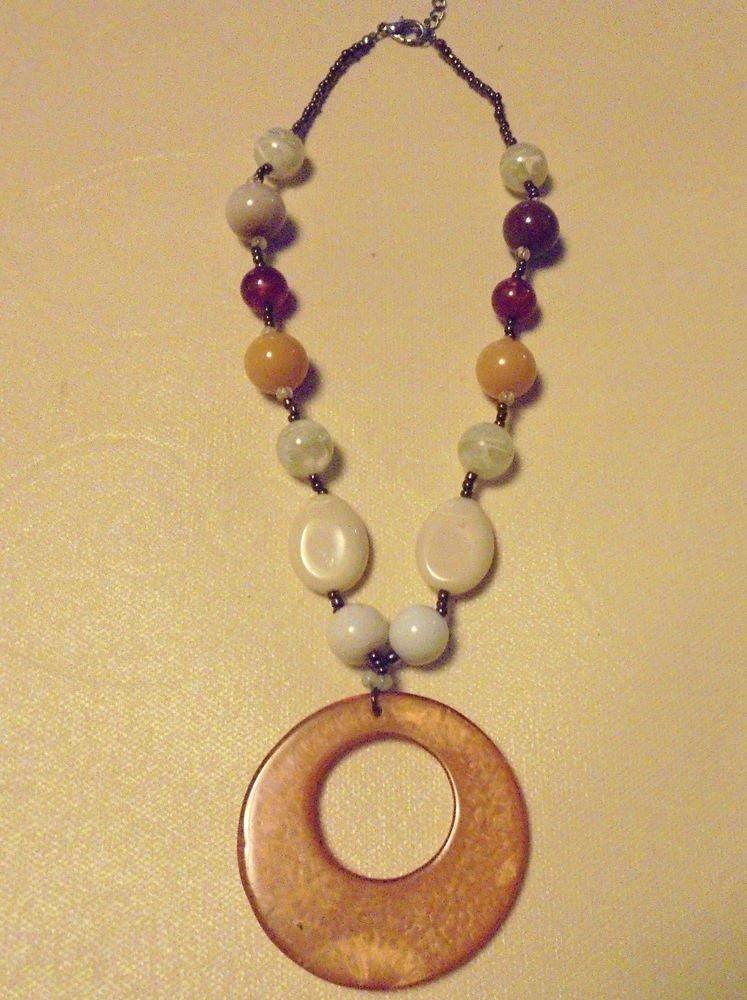 NICE EARTHTONE BEADED NECKLACE...APPROX 22"..ALSO HAS EXTENDER