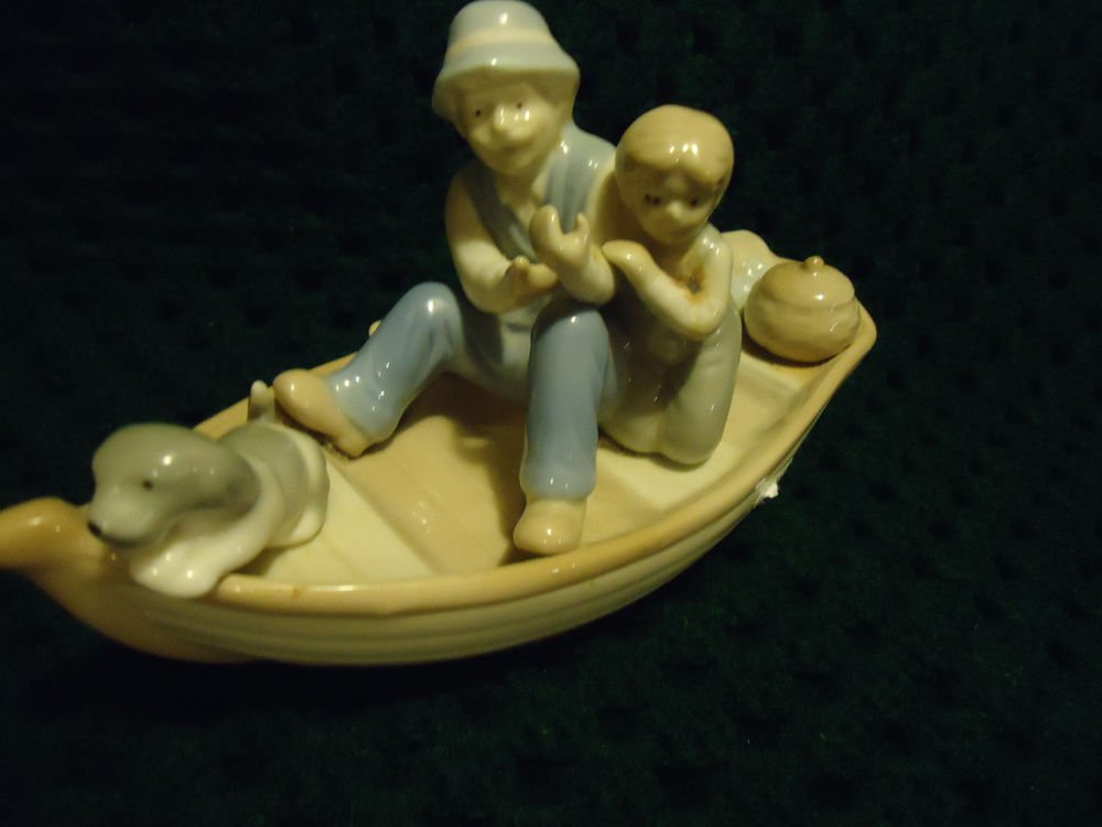 NICE MEICOPORCELAIN MAN FISHING WITH BOY/DOG IN BOAT FIGURINE...NICE QUALITY